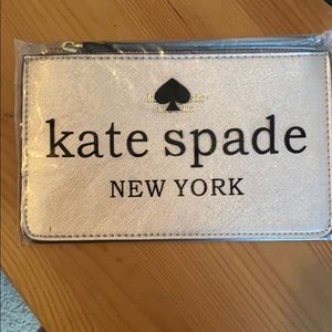Rose gold Kate spade zip pouch.